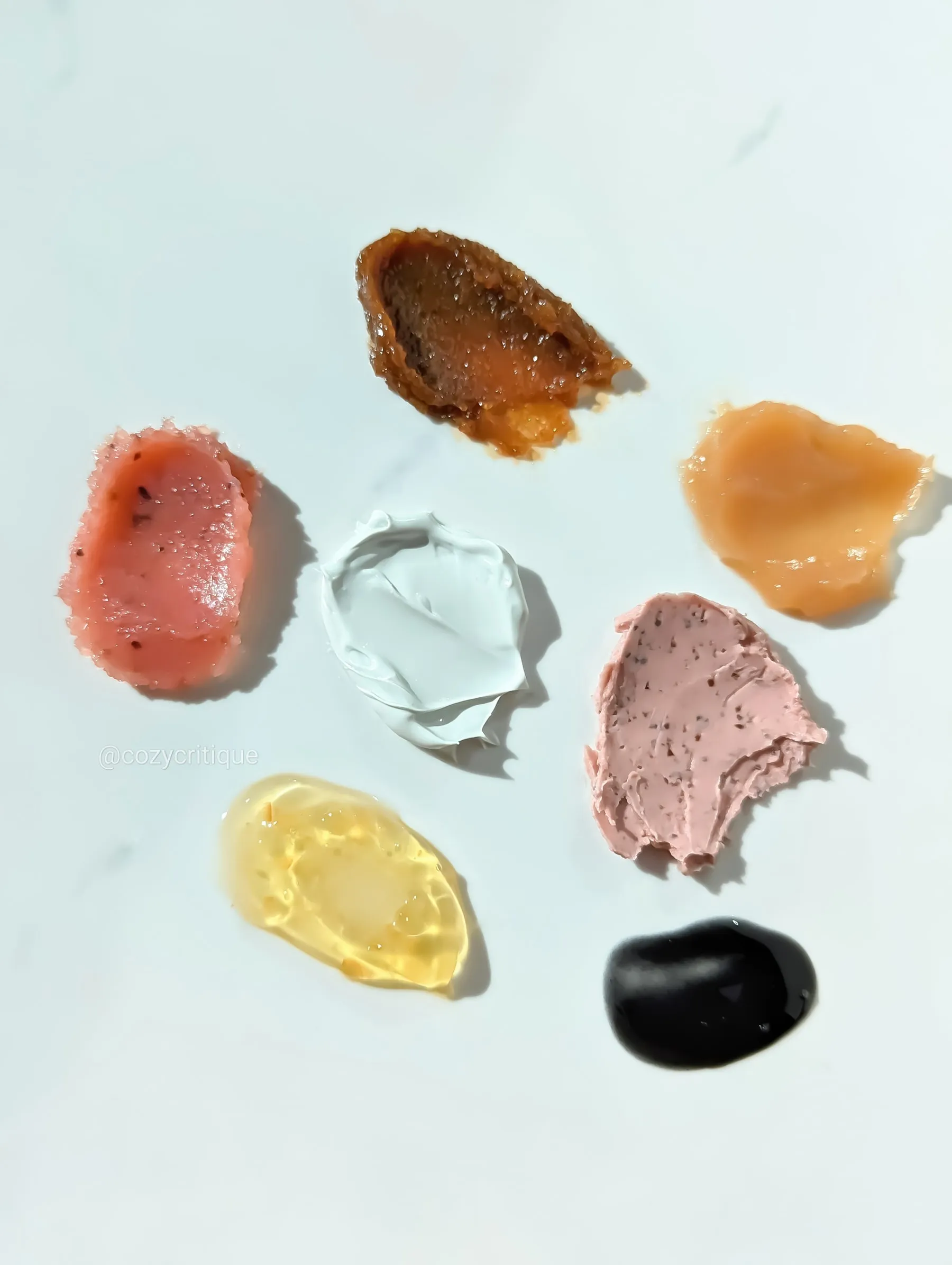 Five wash-off face masks lined up for comparison
