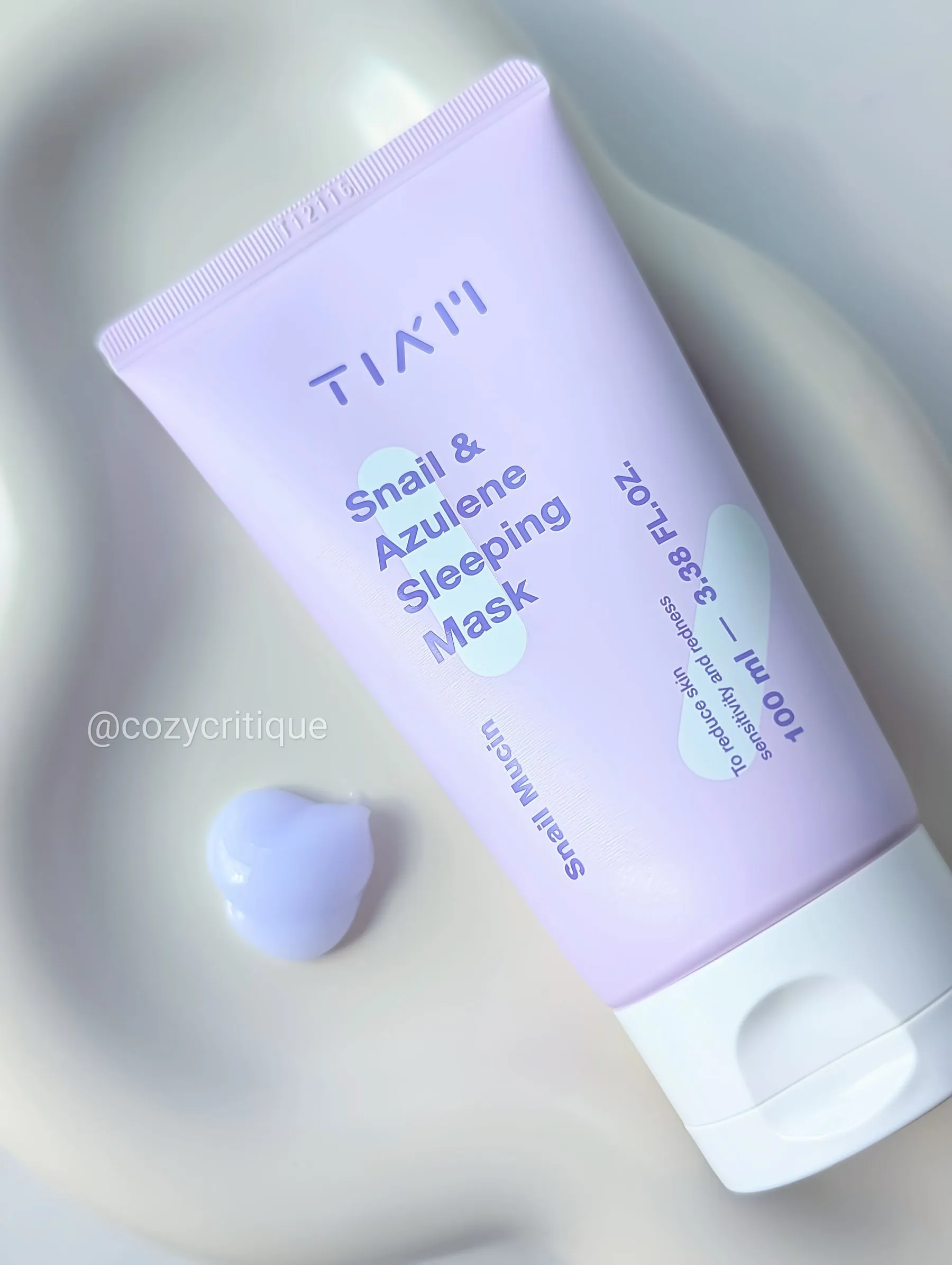 TIA'M Snail & Azulene Sleeping Mask laying on a tray