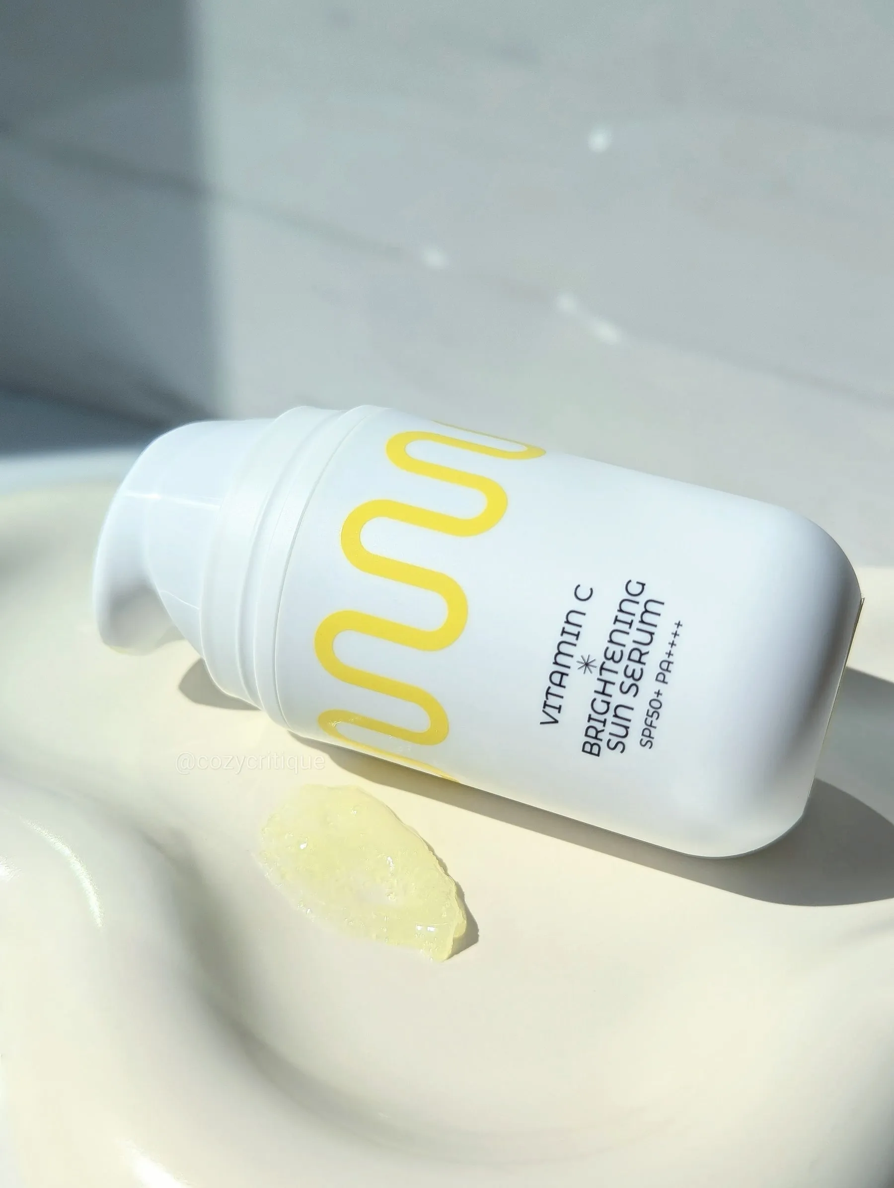 COMMONLABS sun serum texture shot on a tray