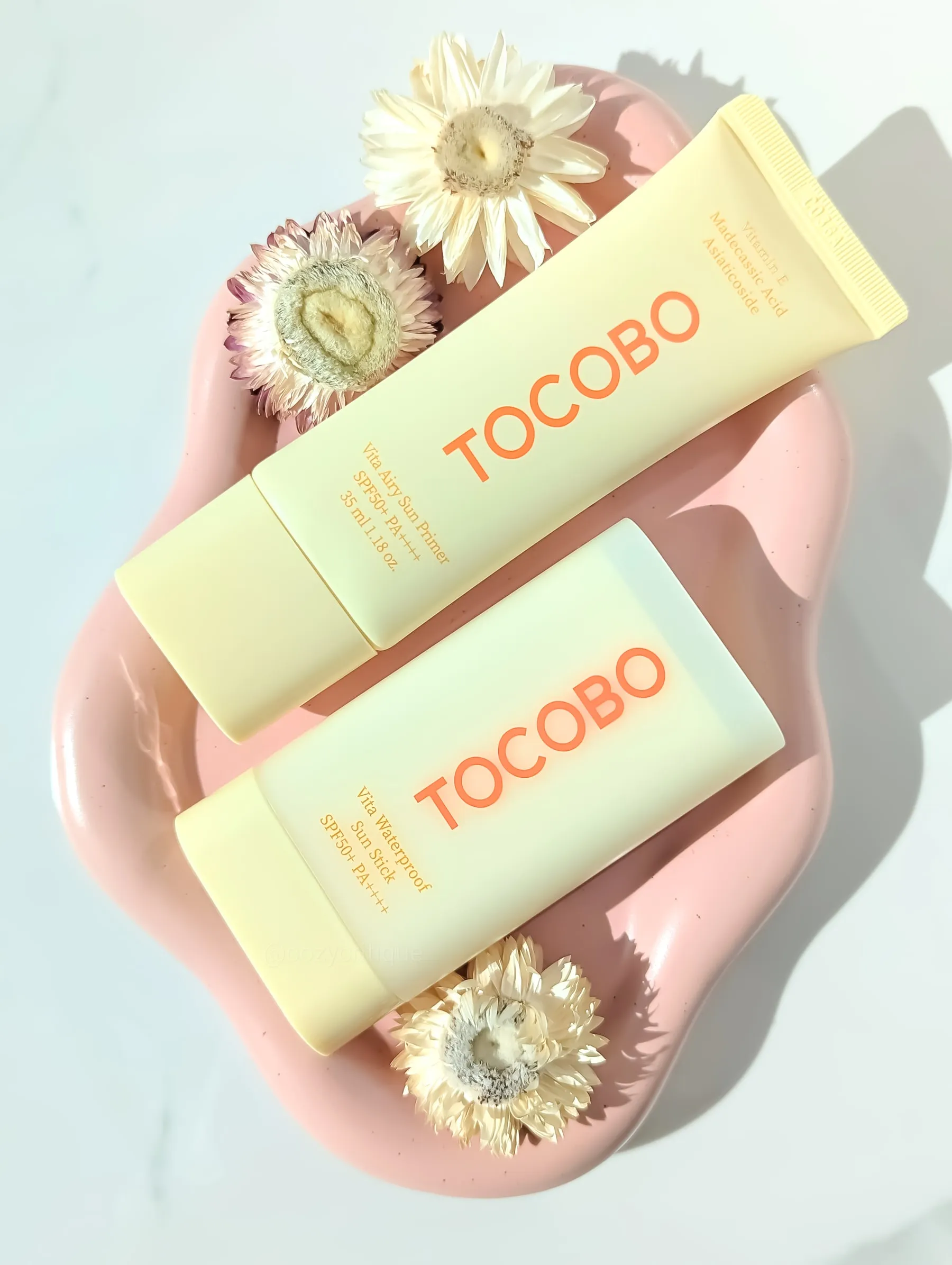 TOCOBO Vita Airy Sun Primer and Vita Waterproof Sun Stick side by side