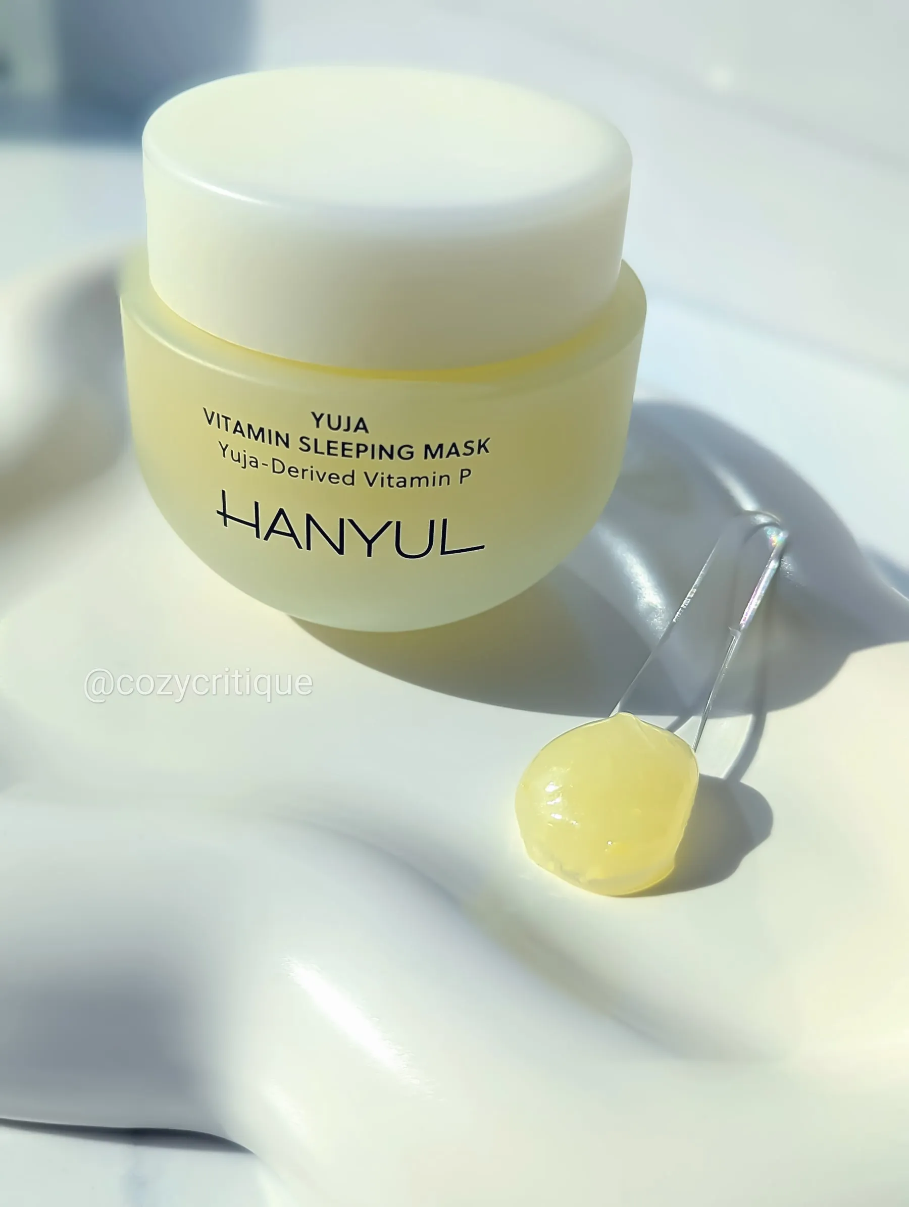 Hanyul Yuja Sleeping Mask on a tray with a spoonful of product