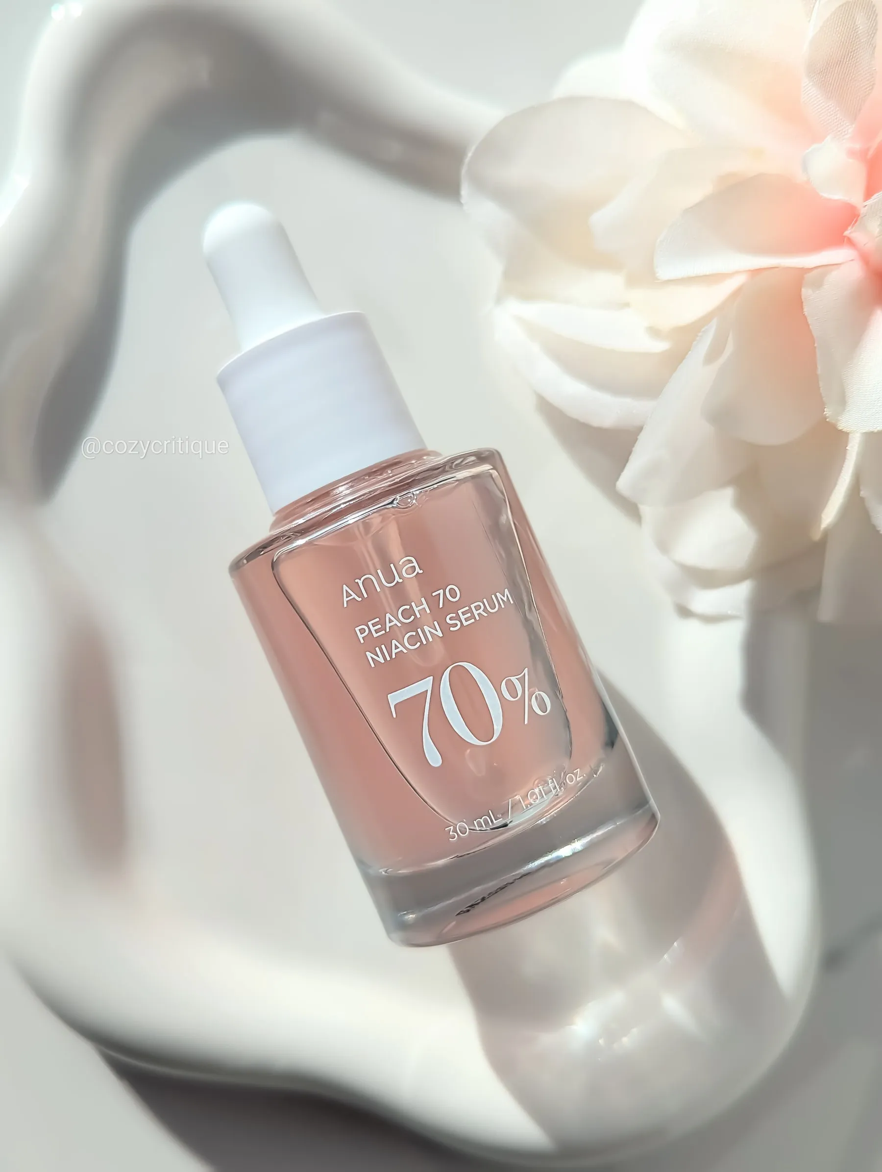 Anua Peach 70 Niacin Serum laying on a tray